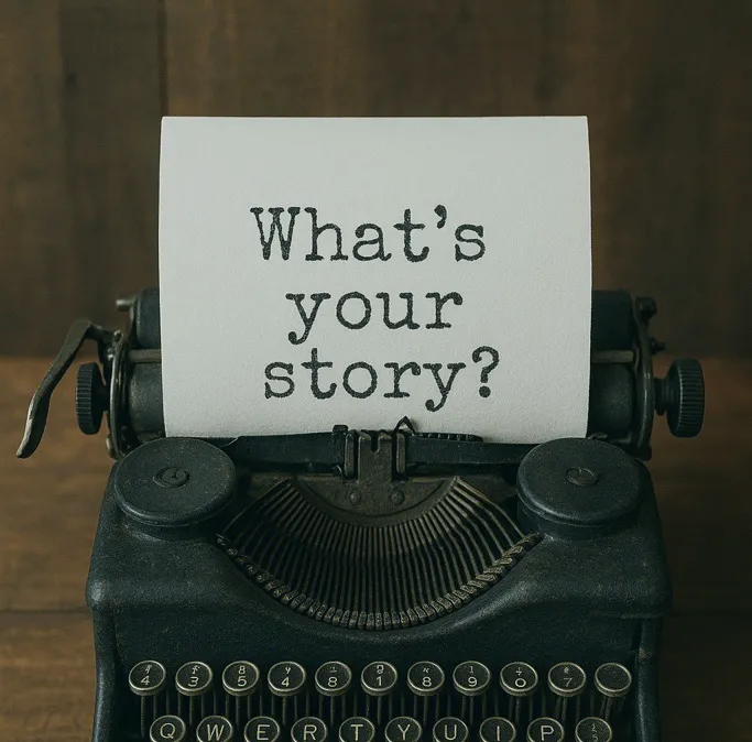 typing machine with "What's your story?" written on paper